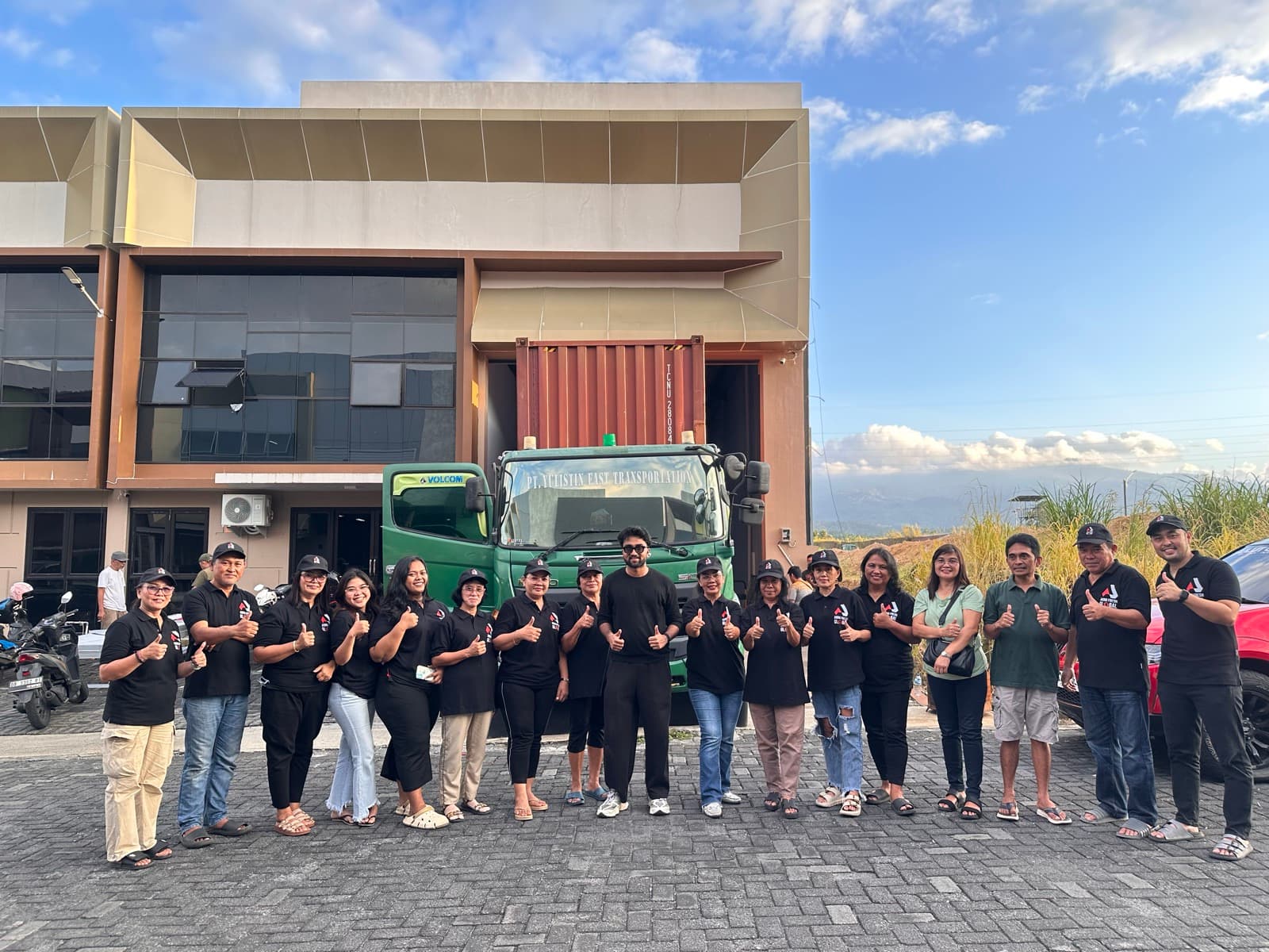 Agro Fresh Global full team in front of warehouse with container truck and Indonesian mountains
